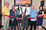 The ribbon cutting for Secure Retirement. Photo by Charlene Rule.