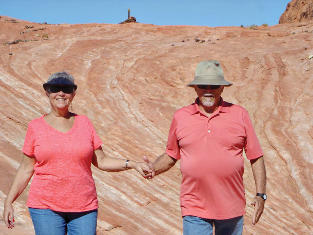 Don and Jaine Toth walking on the path to the fire wave at Valley of Fire State Park.