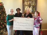 Members of the RR Ladies Social Club presented a check to the Eloy School District Superintendent.