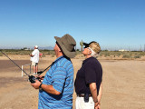 Club members looking to the sky as they fly their aircraft.