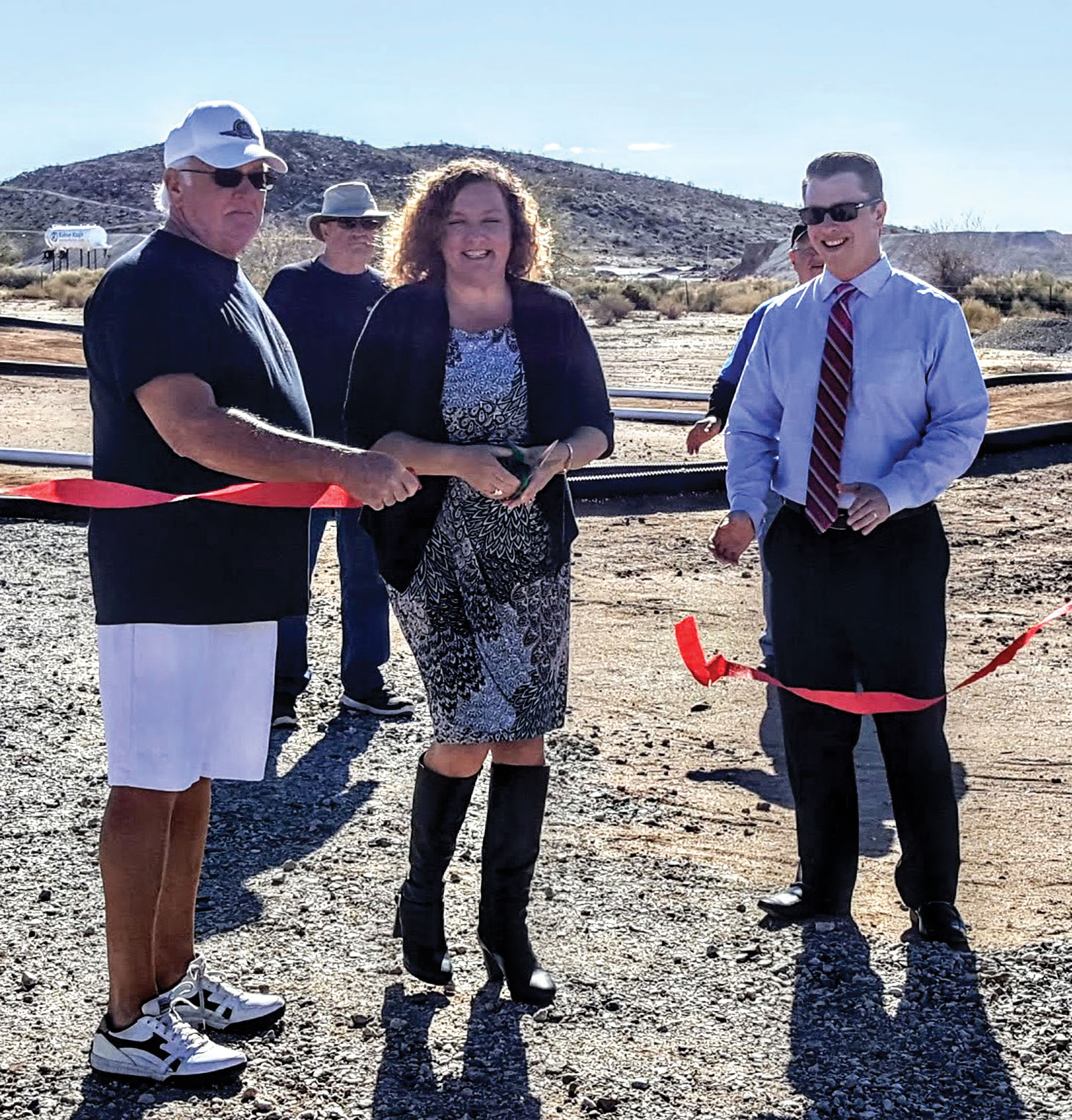 Dave Hudson, Melani Caron and Jeremy Smith participate in the ribbon cutting for the new RC Park.