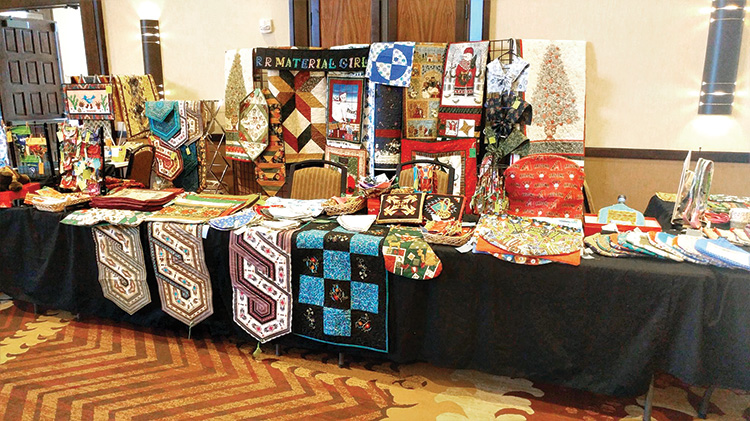 Various sample items shown from the Material Girls’ booth at the November 2018 Arts and Crafts Sale in the Hermosa Ballroom.