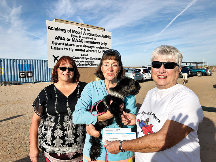 Pictured here, Crystal Fox, Shelter Manager, and Deb Woodard, Valley Humane Society Board President, are accepting checks from Nancy Friedman, Secretary/Treasurer of the Casa Grande RC Flyers in the amounts of $2,000 from the Diane Warren Foundation and $209 from the Robson Ranch Mahjongg group.  