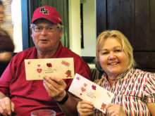 Barb and Bob Wilson, two of the first place winners, who each won a 9-hole round of golf from the Robson Ranch Pro Shop. The other two winners, not shown, were Susan Marian and Cath Lewis.
