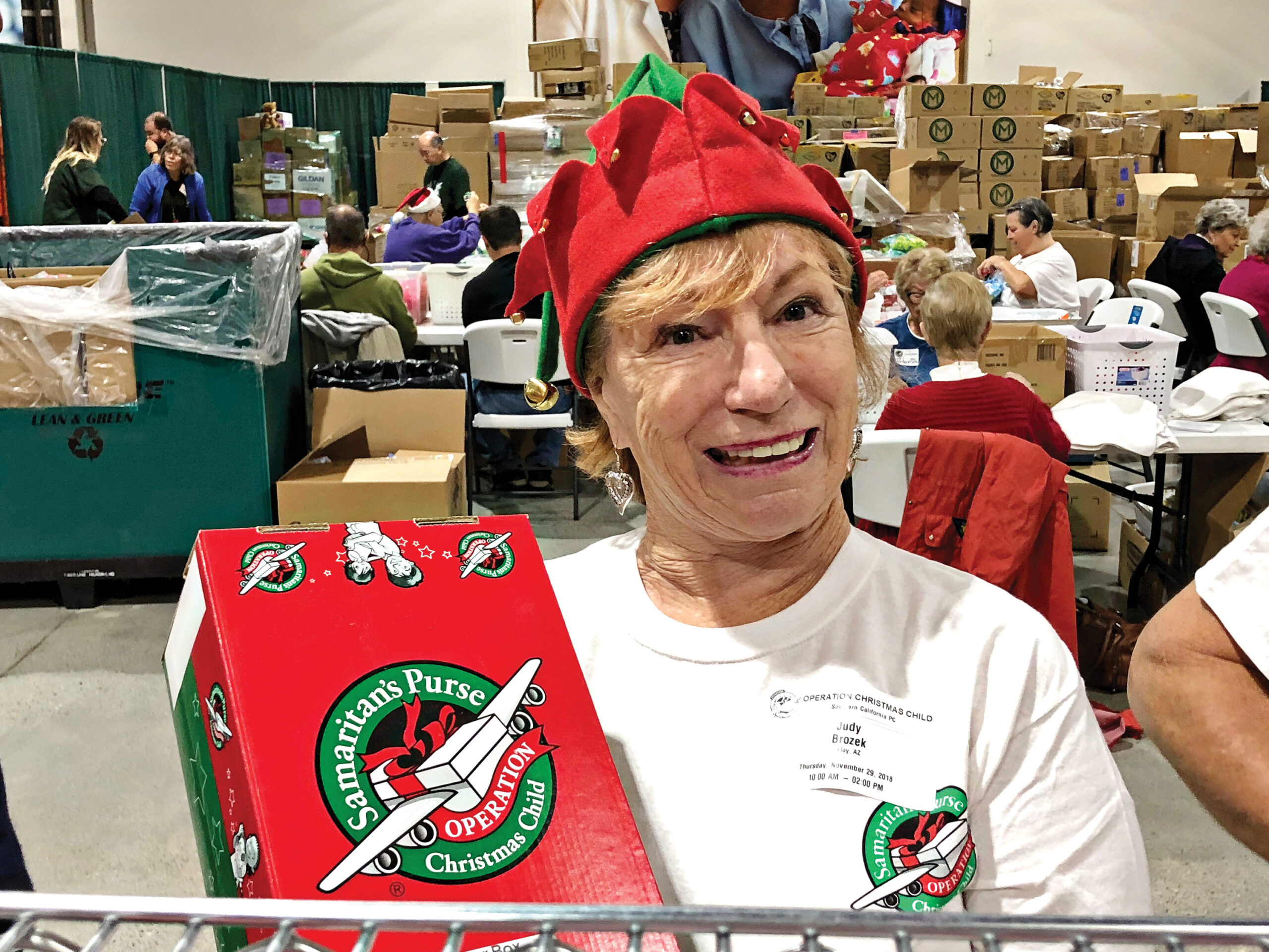 Judy Brozek from Robson Ranch Arizona volunteering and packing shoeboxes.
