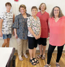 Some of the members wearing their finished tops (left to right): Peg Fortner, Patty Foley, Janita Baugh, Joanne Johnson, and Diane Bohmert.
