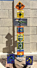 Native American totem/roadrunner/bird on top and two kokopelis garden stakes by Doris Betuel