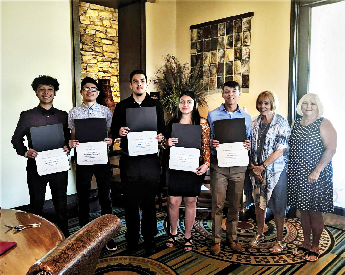The scholarship recipients pose with the club chairs (left to right): Guillermo Martinez, Emmanuel Lule, Mauricio Lopez, Carissa Juarez, Joaquin Jimenez, Ruby Herman, and Debbie Maxwell.