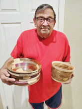 Tom Bruno with two of his bowls; bowl at left
