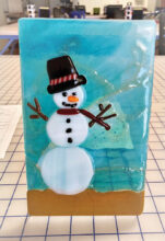 Snowman on blue background by Susan Vaupel