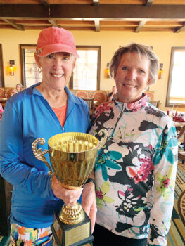 Rhonda McGree (right), presenting Sally Fullington with the Developer's Cup trophy