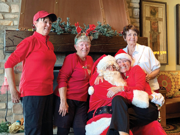 Not everyone gets to sit on Santa’s lap! Pegi Fortner, Dema Harris, Marcia Tiefenthaler, and Mrs. Claus Candy Burtis.