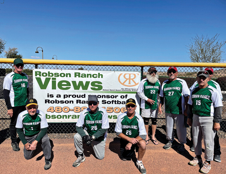 Robson Ranch Softball Club players with the Robson Ranch Views sponsorship banner.