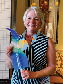 Mary Niesen with her Club Champion award. This year’s beautiful trophies were created by fused glass artist and RRLGA golfer Connie Lundberg.