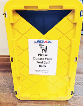 The yellow bin in the Pro Shop to donate unwanted golf balls to JGAA.