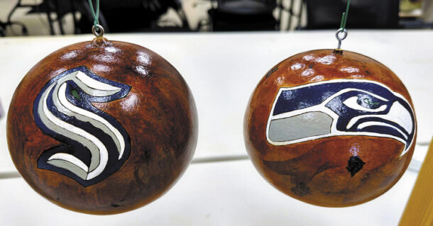 Seattle Kraken and Seahawks ornaments by Faith Pales