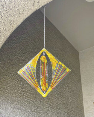 Yellow suncatcher wind chimes by JoannSilva