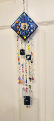 Colorful wind chimes by Roseann James